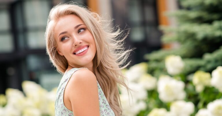 model with sandy blonde hair outside during daytime
