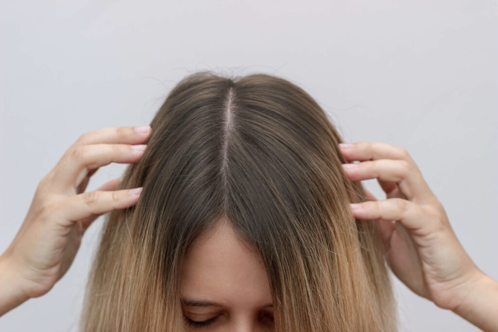overhead look at root smudged hair