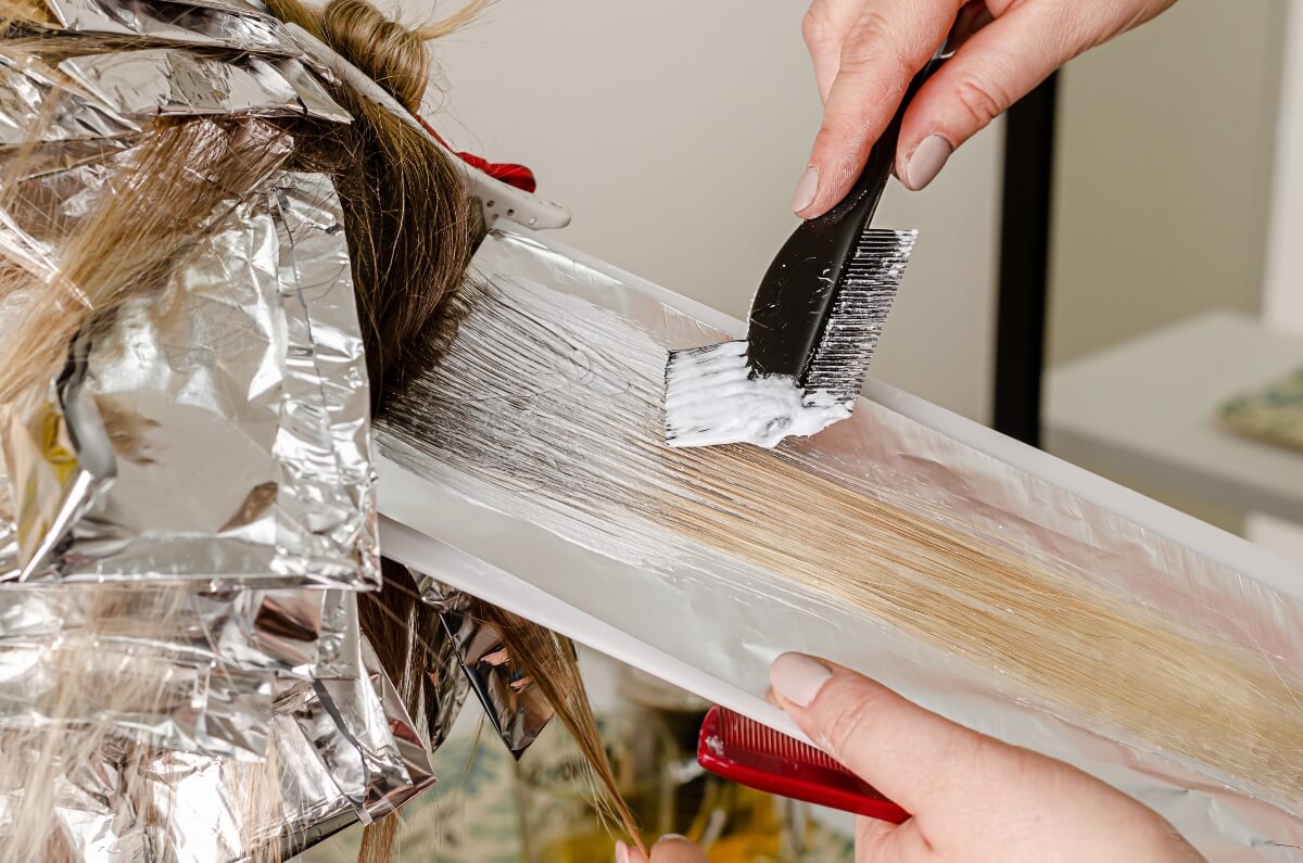 brushing on color to hair over foils