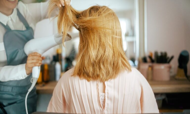 blow drying blonde hair at salong